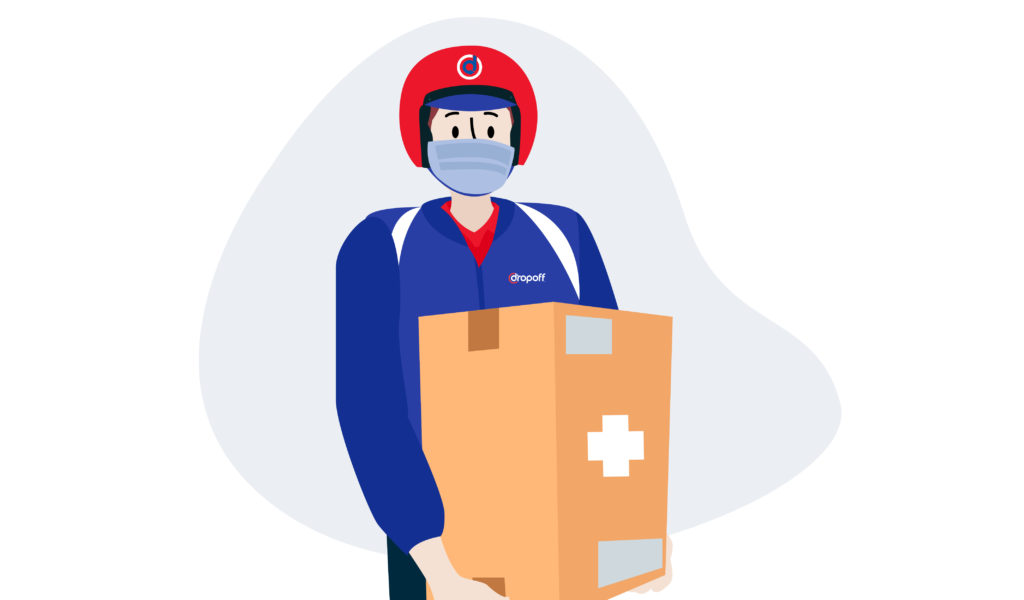 Dropoff medical courier carrying a large package out for delivery